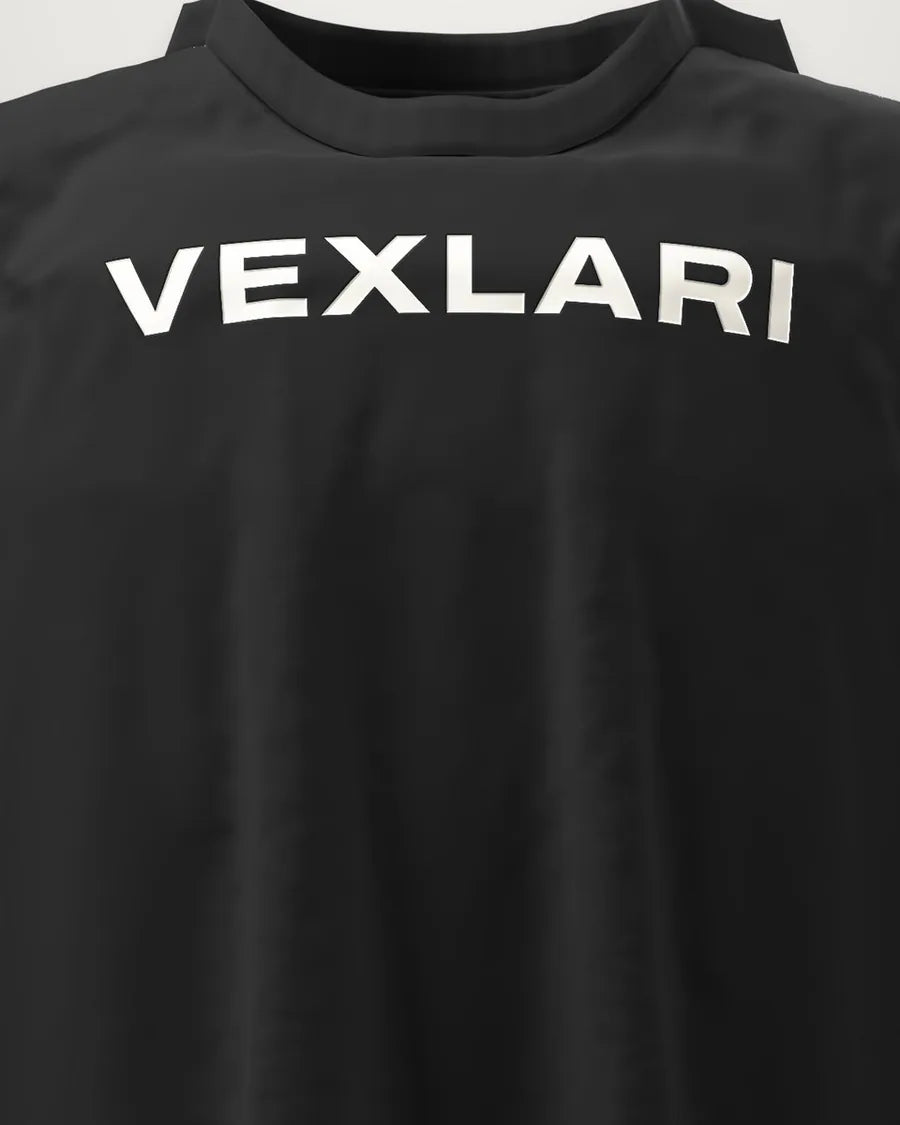 Raised puff-ink VEXLARI wordmark on a black tee